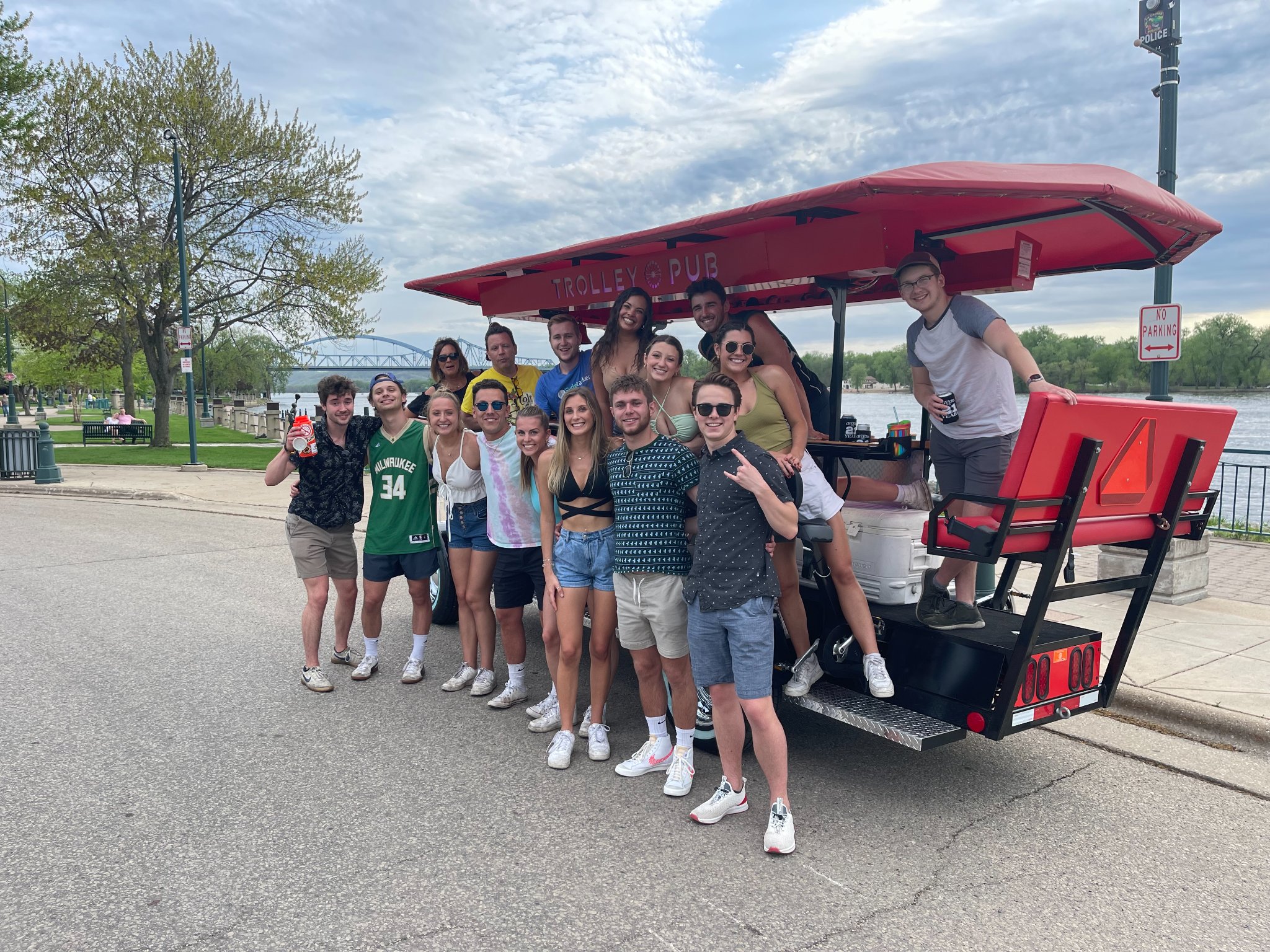 Party bike group photo by the river — a thriving pedal pub market
