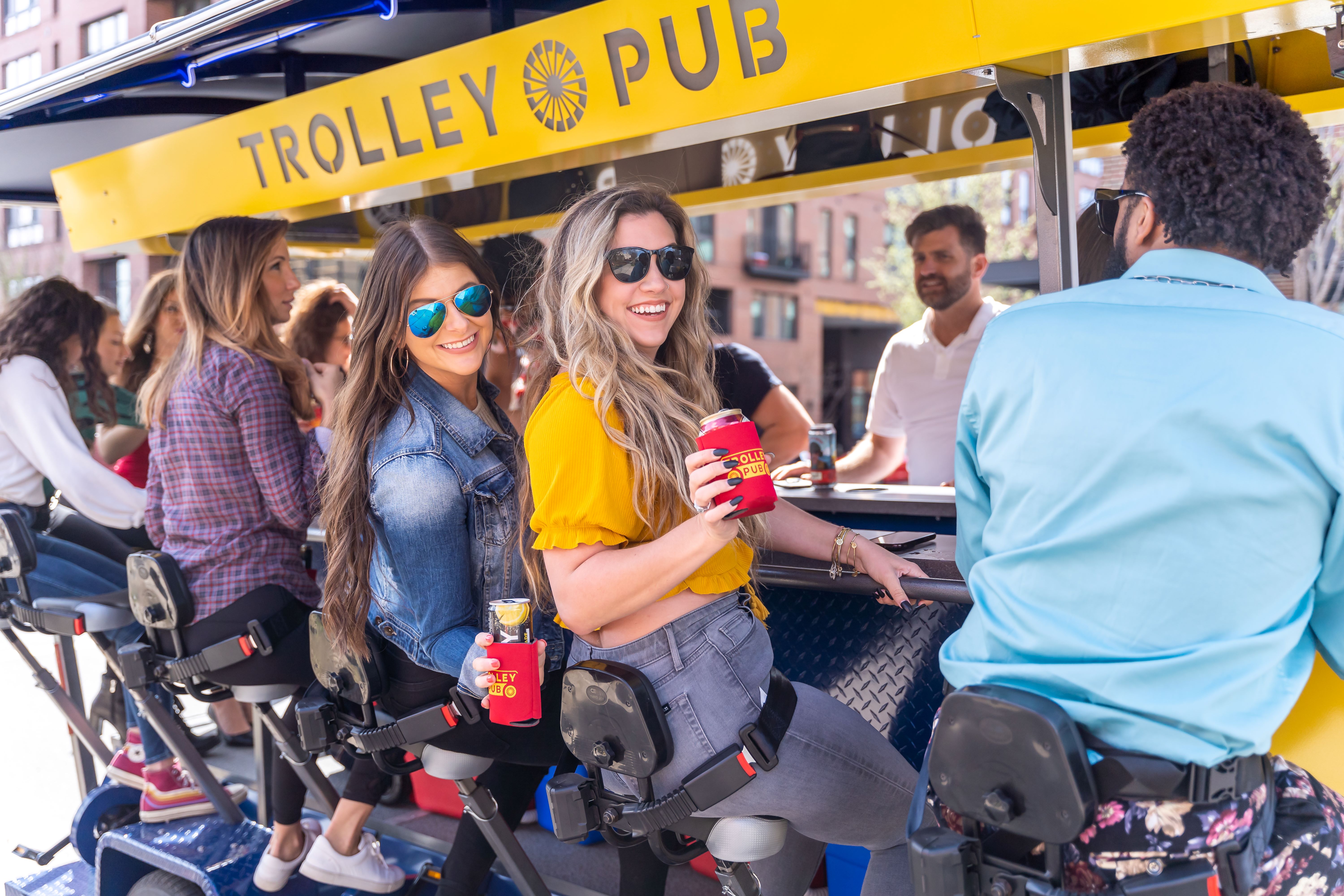 Guests enjoying a pedal pub tour on a Trolley Pub party bike
